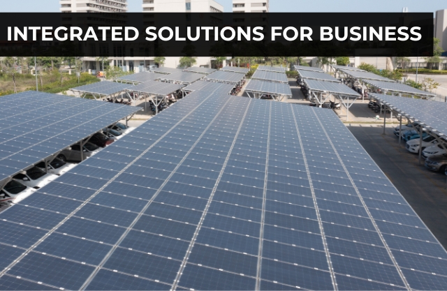 Integrated solar carport solutions for businesses, featuring solar panels in a commercial parking lot.