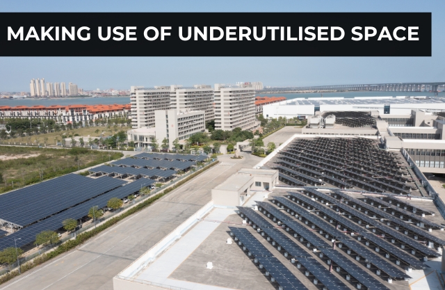 A parking lot transformed with solar carports, providing shade for vehicles and generating power, highlighting one of the biggest advantages of solar carport structures.