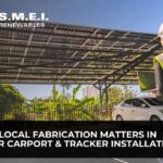 Engineer reviewing a solar carport installation that demonstrates the importance of local fabrication and structural quality.