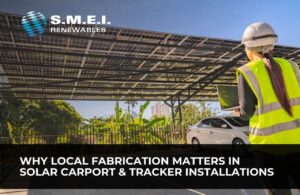 Engineer reviewing a solar carport installation that demonstrates the importance of local fabrication and structural quality.