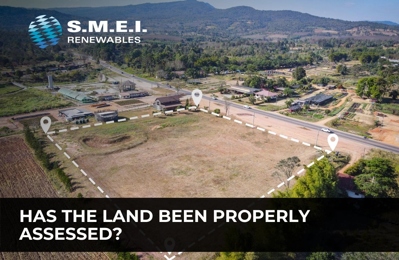 Aerial view of a proposed ground-mount solar site highlighting land assessment considerations such as soil stability, drainage, environmental constraints and grid access.