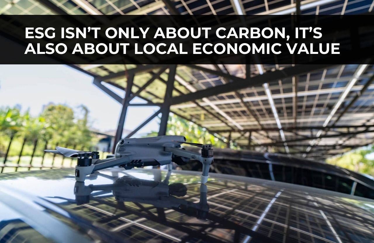 Drone inspection of a solar carport structure highlighting local economic value and responsible infrastructure development.